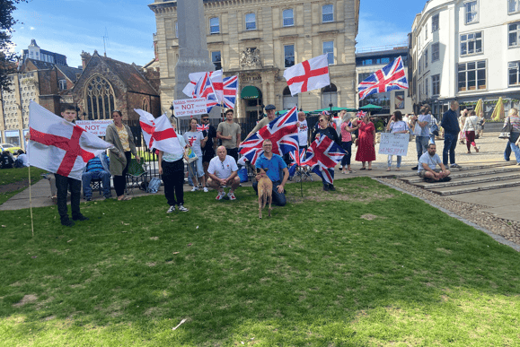 Protesters on Exeter's Cathedral Green after moving from the city's asylum hotel
