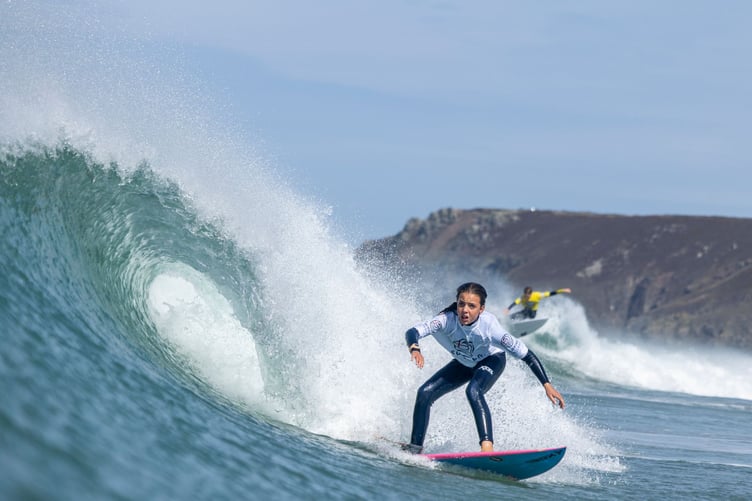 A surfer in the women's division at the 2025 Interclub Surfing Championships