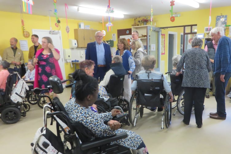 Staff and residents at Woodlarks celebrate 75 years of care.