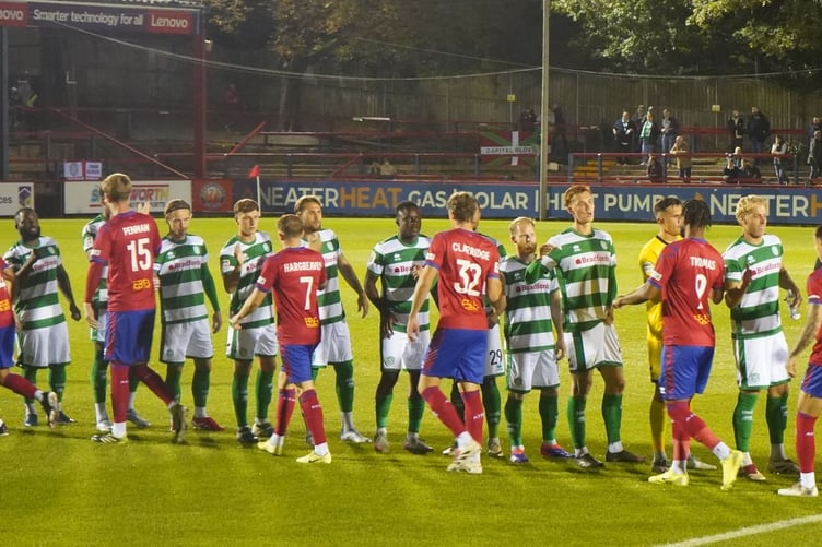 Aldershot Town and Yeovil Town shake hands before their National League encounter