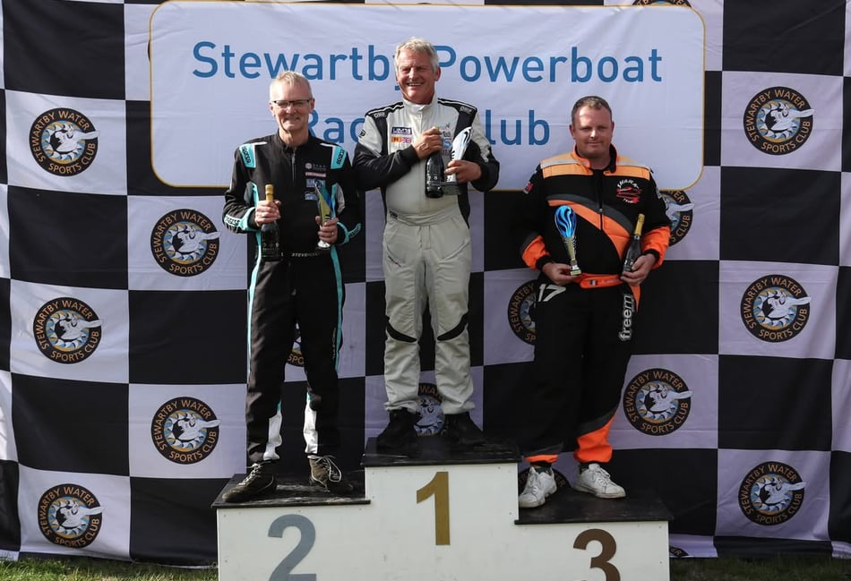 <p>Kingfisher’s Ian Blacker tops the Formula 2 Circuit Powerboat Association British Championship podium at Stewartby ahead of Steve Hoult in second and Romain Nedelec in third (Photo: Ian Wilson).</p>