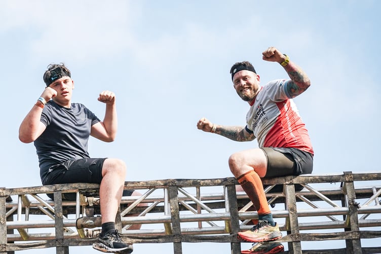 Surrey veteran James Shaw and his son Leon complete the Tough Mudder race.