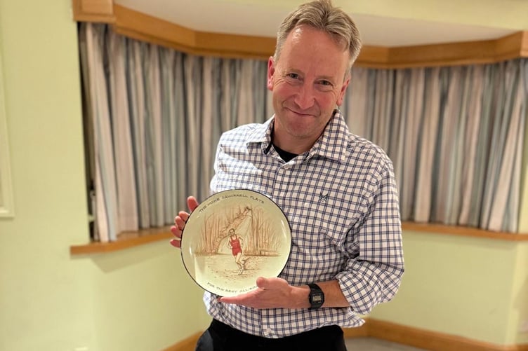 Mike Squirrel plate winner Tom Frost