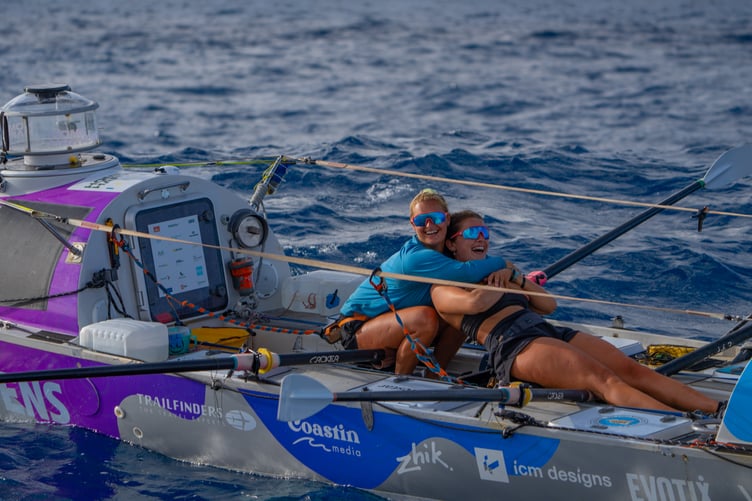 Big hugs after Jess Rowe and Miriam Payne finish their Pacific crossing.