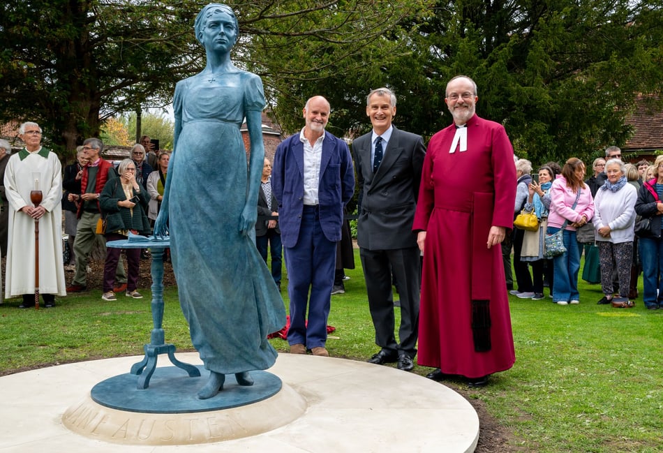 <p>Sculptor Martin Jennings, Hampshire Lord-Lieutenant Nigel Atkinson, and the Revd Canon Dr Roland Riem at the unveiling of a Jane Austen statue at Winchester Cathedral.</p>