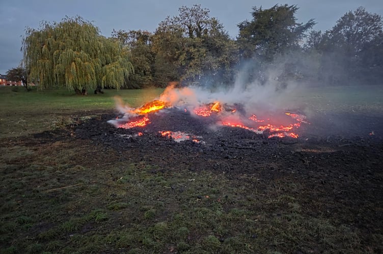 The smouldering remains of the bonfire tower built for the Ripley Bonfire event.