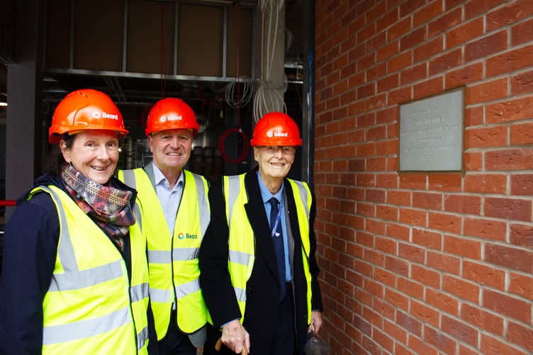 Chris Tuckwell, president of Phyllis Tuckwell and son of Sir Edward and Phyllis, with chief executive Sarah Church and chair of the trustees Dr Robert Laing lay the new hospice's foundation stone.