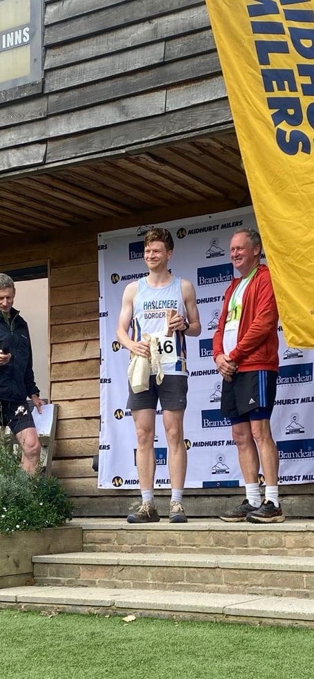 Duncan Selmes receives the Blackdown Hill trail race winners trophy