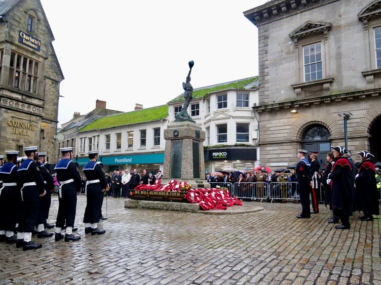 Paying respects at the war memorial on Remembrance Sunday in Truro's Boscawen Street
