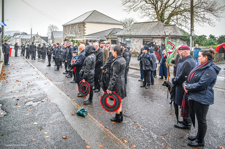Wreath bearers, St Dennis Band and villagers during the wreath laying ceremony at the St Dennis War Memorial Institute. (Picture: Derek R Williams)