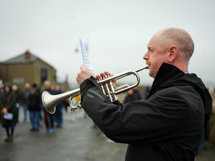 Humphry Davy School music teacher Matt Street plays the Last Post