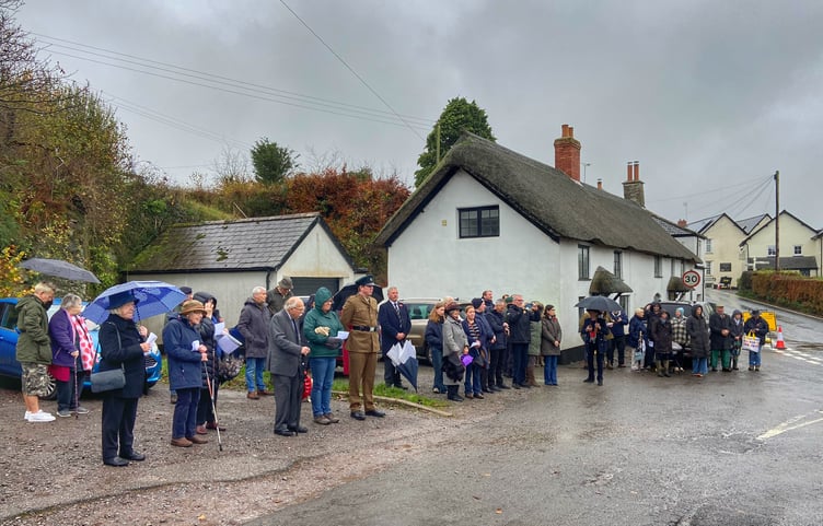 Villagers line the road in Cutcombe ready to join a two-minute silence on Armistice Day. PHOTO: Leanna Coles.
