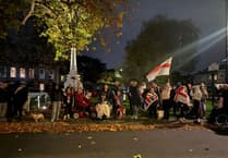 Surrey residents mark 100 days of protest outside asylum seeker hotel