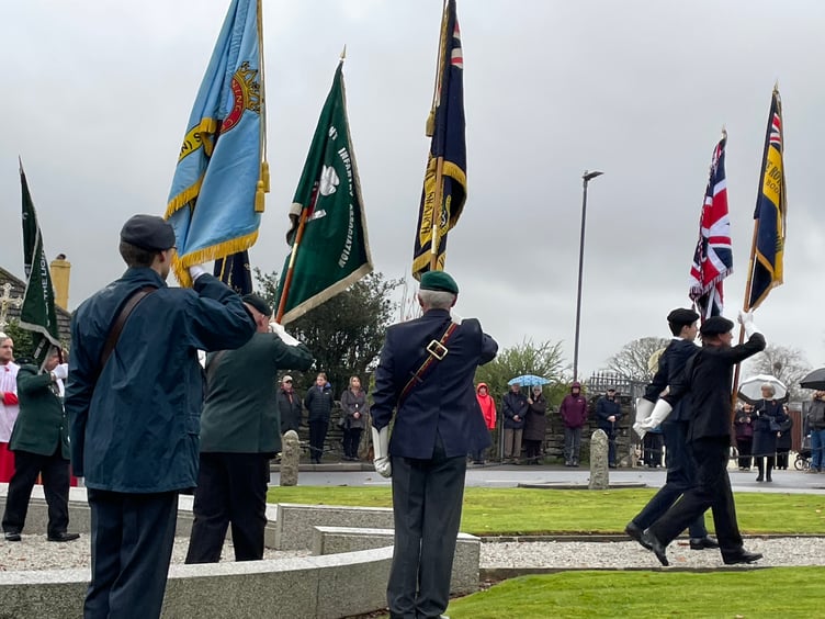 Standard bearers begin the march away from the Bodmin Keep as they start the journey towards the memorial in Priory Park (Picture: Aaron Greenaway)