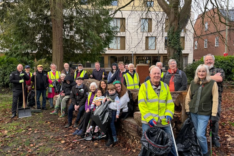Volunteers gather for a briefing and to collect their equipment before heading off to the litter pick in Farnham.