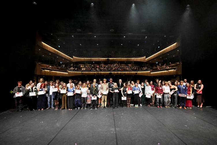 Recent recipients gather on stage for a group photograph during a celebration gala to mark the 20th anniversary of Young & Talented Cornwall, the Lord Lieutenant's Fund, at the Hall for Cornwall