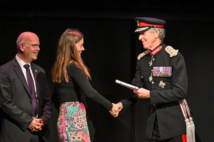 Sir Edward Bolitho, Lord Lieutenant of Cornwall, on stage with a young grant recipient during a celebration gala to mark the 20th Anniversary of Young & Talented Cornwall, the Lord Lieutenant's Fund, at the Hall for Cornwall