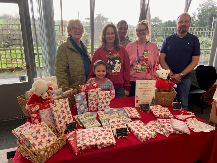 The Koka and Lanaway families running the Mystery Book Stall