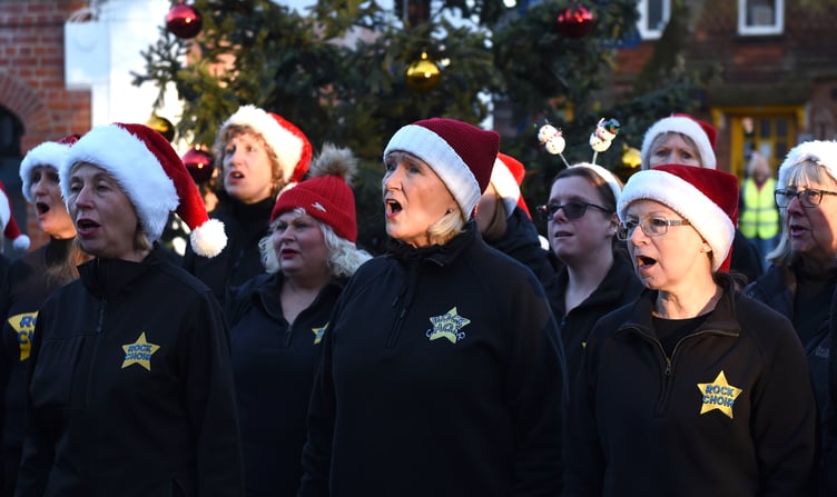 The Rock Choir sing their hearts out in Santa hats (Photo: Ian Longthorne).