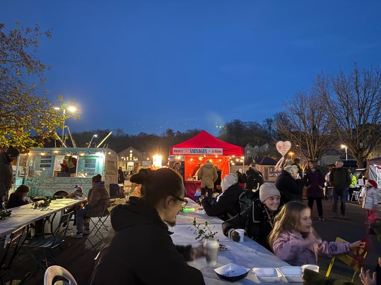 Visitors enjoy food and music at the Festive Food Court.