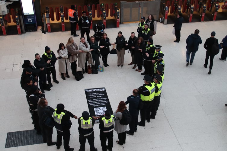 White Ribbon Day at London Waterloo: SWR staff form a human chain to raise awareness of violence against women and girls