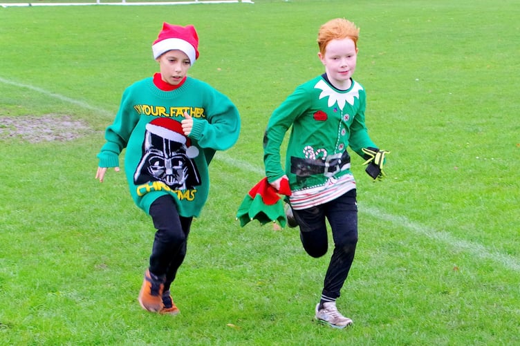 A prize was given for Watchet's fastest children's Santa fun runner. PHOTO: JAG Photo.