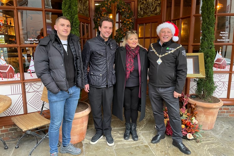 From left, Ben Robinson, commercial development manager for UCA Student Union, Farnham BID manager Janie Elliott-Dunn, and Town Mayor George Murray celebrate with the event winner Tavola Di Famiglia owner Jamie Haworth.