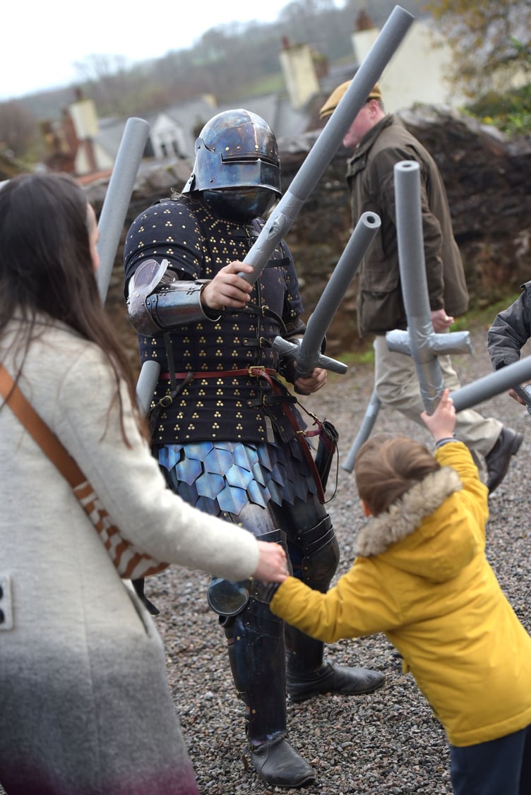 Children visiting Dunster Winter Festival were able to do battle with knights in armour. PHOTO: Nina Dodd.