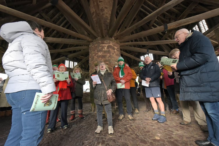 Carol singing in Dunster Yarn Market during the village's winter festival. PHOTO: Nina Dodd.