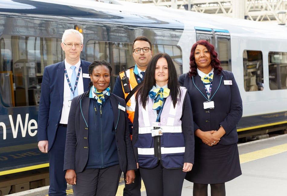 <p>SWR colleagues by a train.</p>