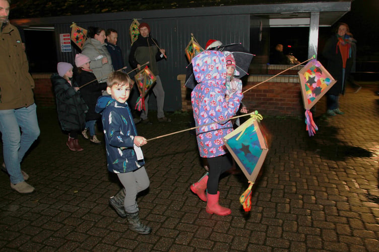 A lantern-lit procession in Watchet escorted Father Christmas to his grotto. PHOTO: George Ody.