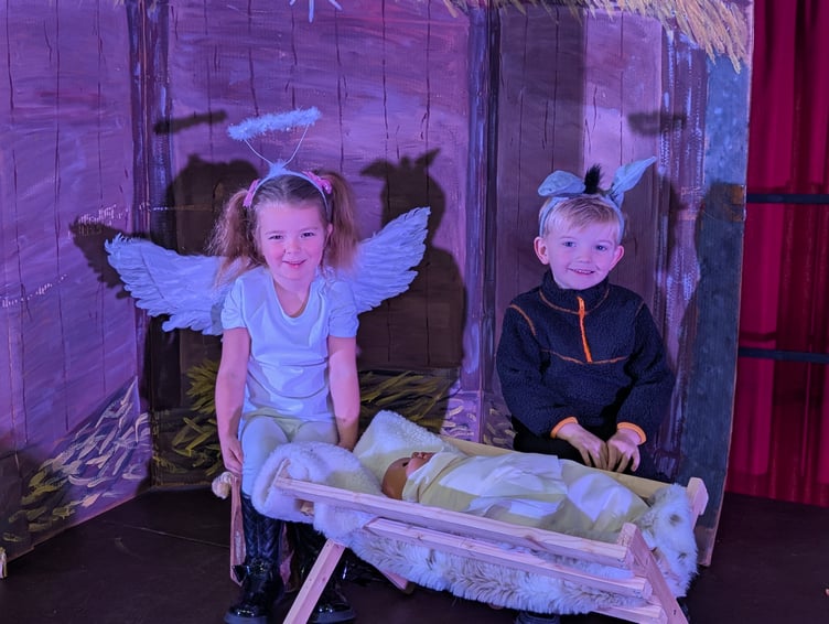 St Mary's Reception pupils Faith and Arlo with the crib