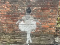 Mystery street artwork appears on wall in Farnham