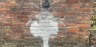 Mystery street artwork appears on wall in Farnham