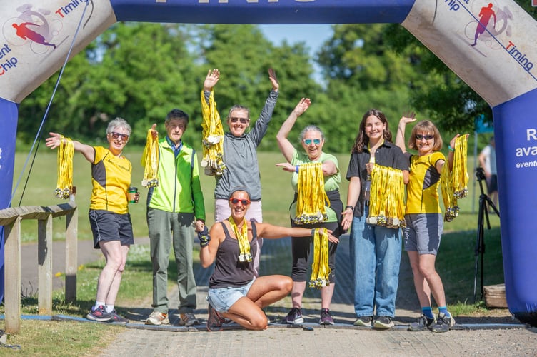 Alton Runners with Alton 10 Mile Race medals.