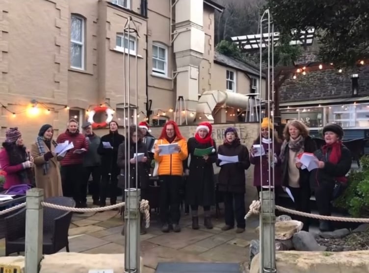 Carol singing in Porlock Weir for the first ever 'Weir Christmas' event.