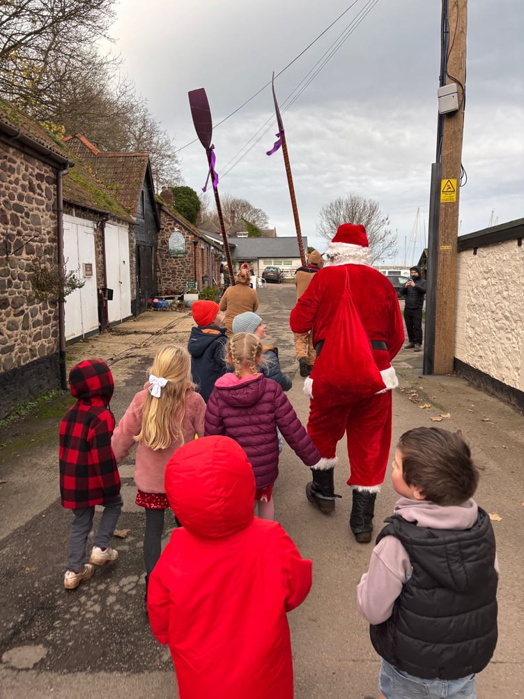 Santa heads to Porlock Weir's Old Boat Shed where a grotto was set up for him to greet local children.