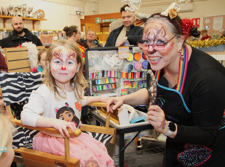 Five-year-old Ava Ashman has her face painted during Porlock's Christmas lights switch on evening. PHOTO: George Ody.