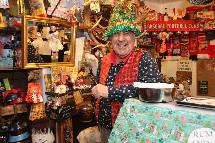 Richard Growden, of Squires, enters the spirit of Porlock's Christmas lights switch on event PHOTO: George Ody.