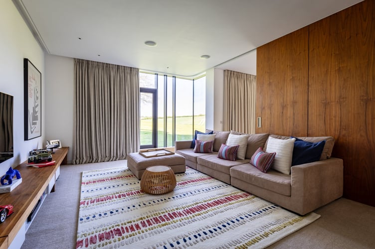 Downley House in South Downs National Park, near Petersfield, Hampshire. A house that was featured on Grand Designs has had to slash its price by a whopping £750,000 after failing to sell for 18 months.Downley House was listed for sale in July 2024 with a guide price of £5 million when owner Chris Taee decided it was time to sell up after 12 years in the property.Taee built the 7,374 sq ft oak-clad house from scratch, which boasts five bedrooms - three in the family wing and two guest bedrooms - five bathrooms and an oval-shaped central dining area with a 23ft high ceiling.The house was used by Kevin McCloud to host the Grand Designs House of the Year show there, whilst also being shortlisted for the RIBA House of the Year award.The property is built on 2.5 acres within a valley of South Downs National Park, near Petersfield, Hampshire.