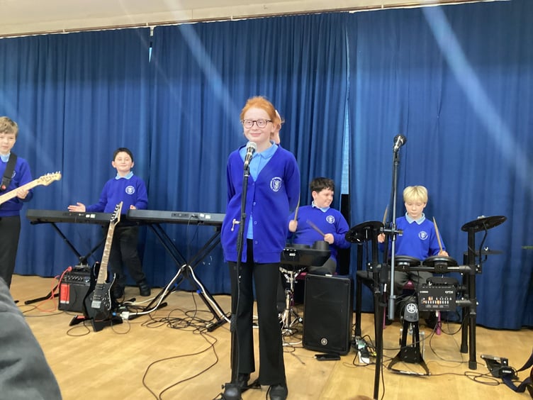 Children take to the stage with guitars, keyboards and drums as part of the school’s Rocksteady music programme.