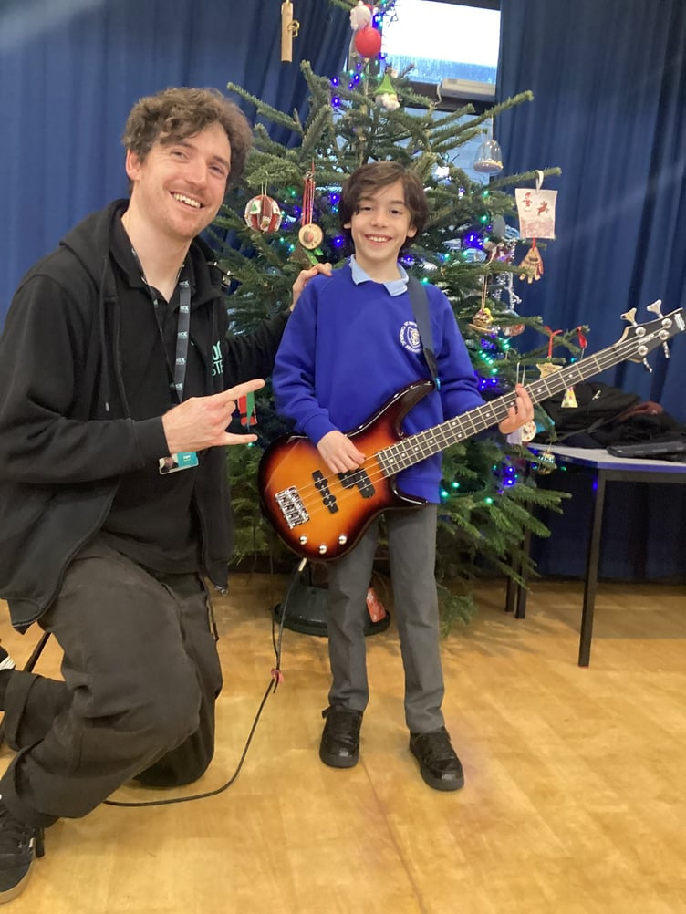 Angus with a St Benedict's band member