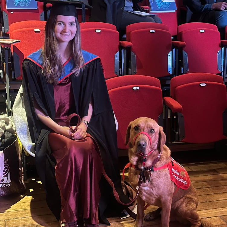 Daisy Cottle-Bailey of Farnham with her Labrador medical detection dog Jarvis.