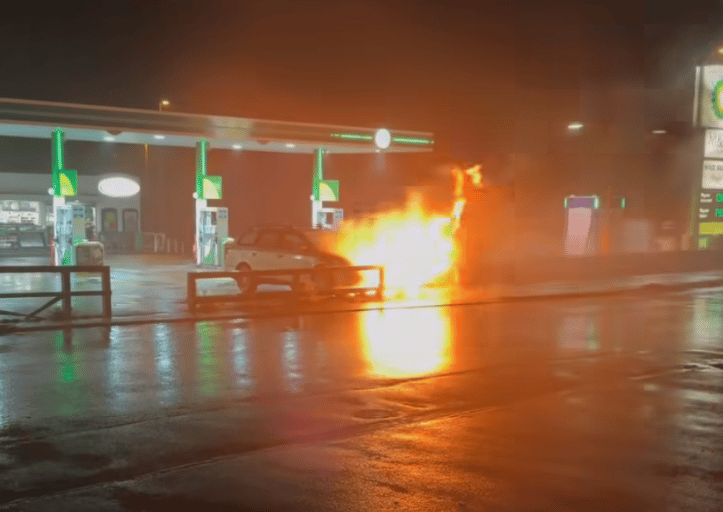 <p>The car on fire at the BP petrol station in Four Marks last night (Photo: Corey Howard).</p>