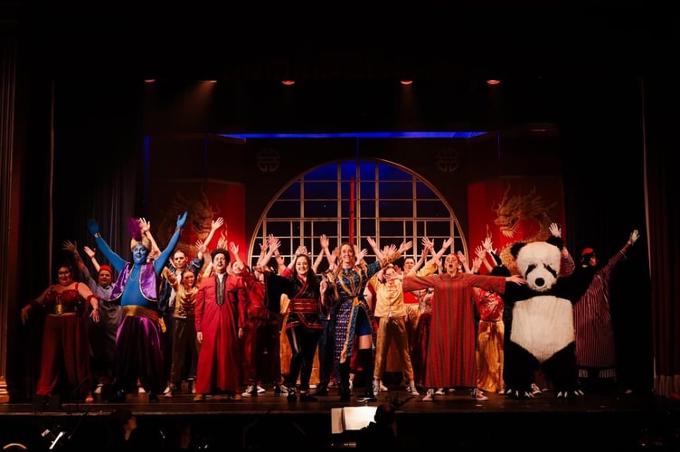 The full cast of Haslemere Thespians’ Aladdin light up the stage with songs, dance, and plenty of audience fun. Credit:  Front of House Photography