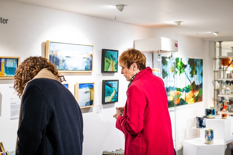 Guests admire the artwork in at the New Ashgate Gallery in Farnham.