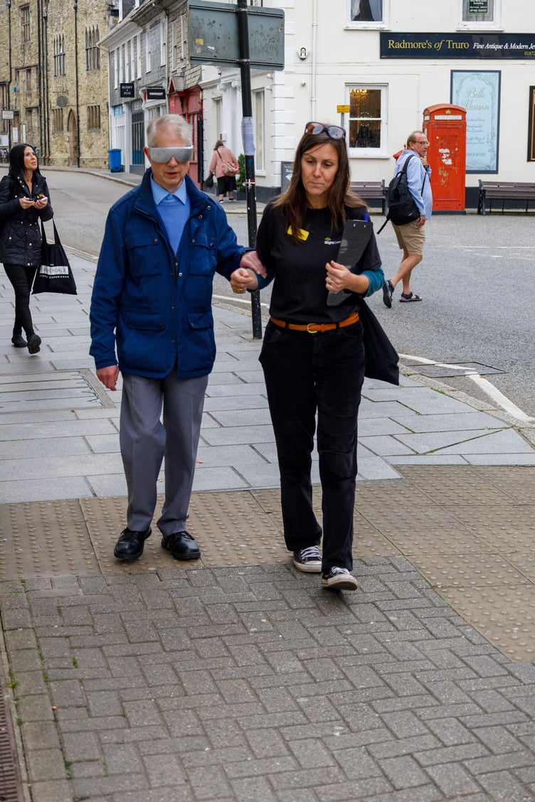 Cllr Chris Wells experiences Truro city centre while wearing visual impairment goggles