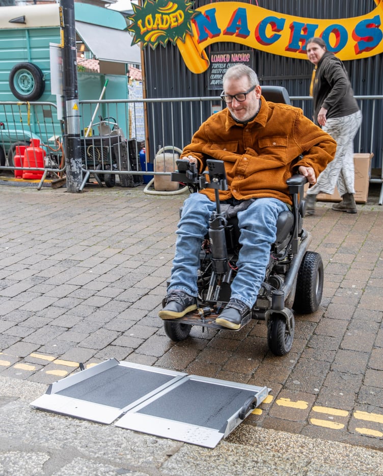 Cllr Steven Webb uses the portable ramp to access the Hall for Cornwall