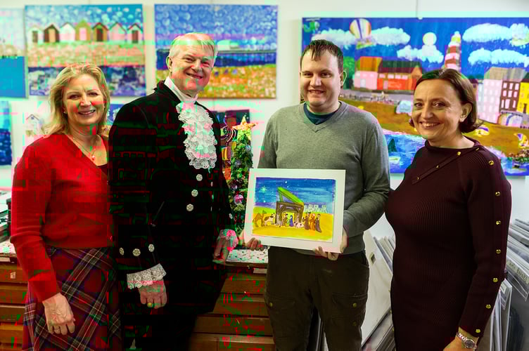 The High Sheriff of Surrey Peter Cluff with the winner of his Christmas card competition.