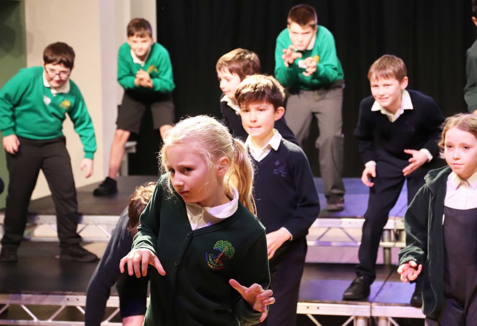<p>Year 5 pupils from Highfield and Brookham join friends from Beacon Hill and Easebourne Primary to rehearse songs and dance moves.</p>